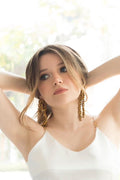 Aretes de moño dorados